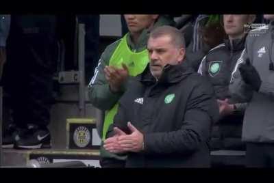 Celtic fans chant during the minute's applause.