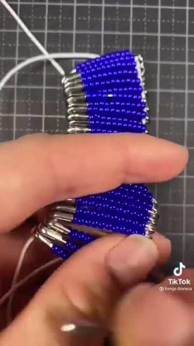 This lady creates amazing clothing out of safety pins and they are absolutely stunning