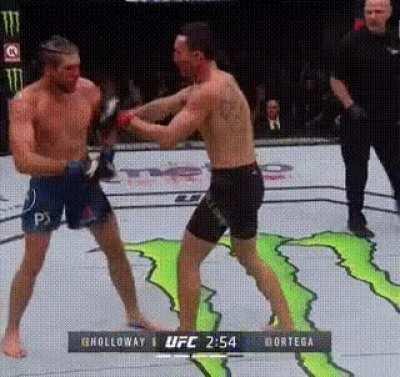 Max Holloway teaching Brian Ortega to block punches mid fight. COLD.