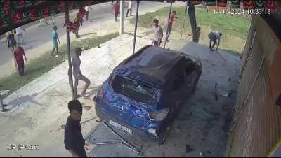 A mob goes to town on a Muslim family's car in India