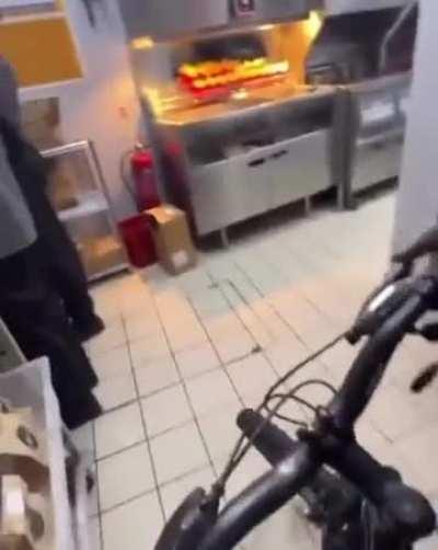 Man goes for a bike ride in McDonalds