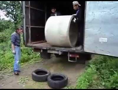 WCGW unloading a concrete pipe with tires