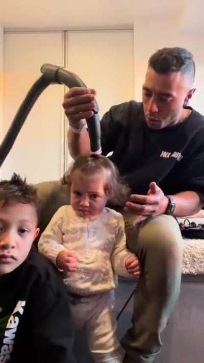 Dad becomes a vacuum hair stylist.