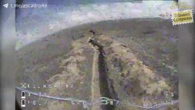 The lonely and horrified Russian soldier in his fortified trench was being targeted by a Ukrainian kamikaze drone.