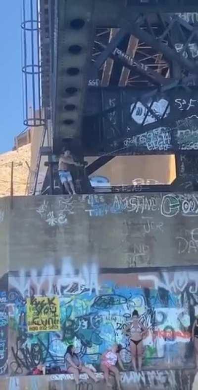 WCGW swinging on a rope under a bridge