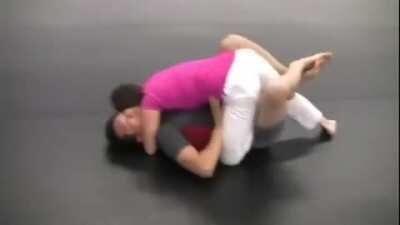 Small female BJJ purple belt is challenged by much bigger guy in grappling and owns him.