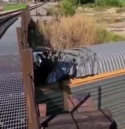 Train scraping it's roof under a bridge