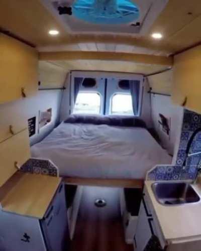 This adjustable elevated bed in a camper van