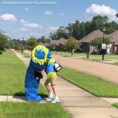 He greets his younger brother everyday after school by wearing a different costume each time.