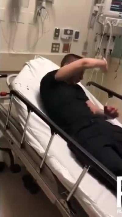 Two cops film themselves assaulting suicidal man in hospital bed.