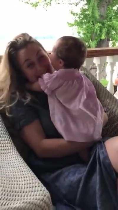 Baby attacks with kissed