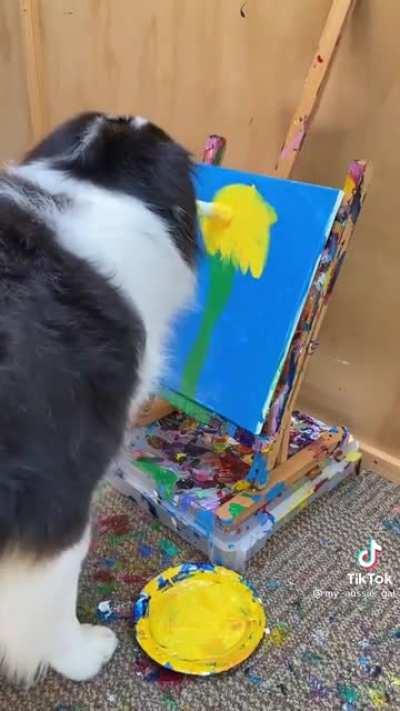 Doggo paints a beautiful flower!