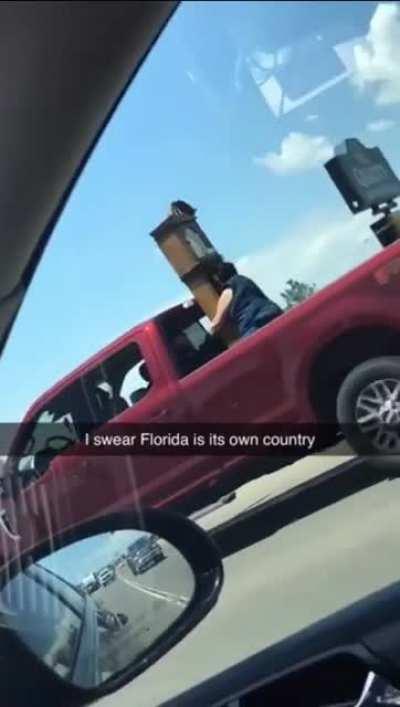 Florida man holds massive clock on flatbed