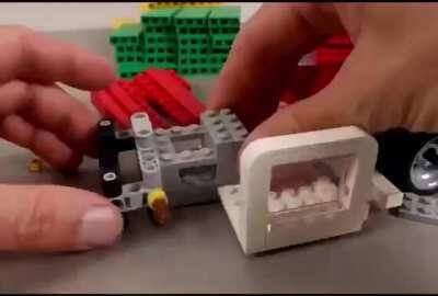 Lego-made machine for making domino snakes