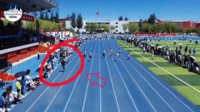 A university student in China went viral after footage of him sprinting alongside a track while filming a 100m dash hit the web