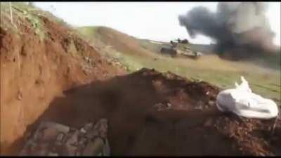 T-55 reverses just in time to avoid getting hit by an ATGM, while the loader bails.