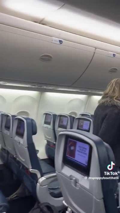 Woman kicked off of plane but refuses to leave