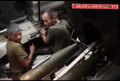 Ukrainian artillerymen active inside the Polish Krab artillery piece, hidden in the treeline, fire at Russian military hardware in Donbass, Eastern Ukraine. August 2022