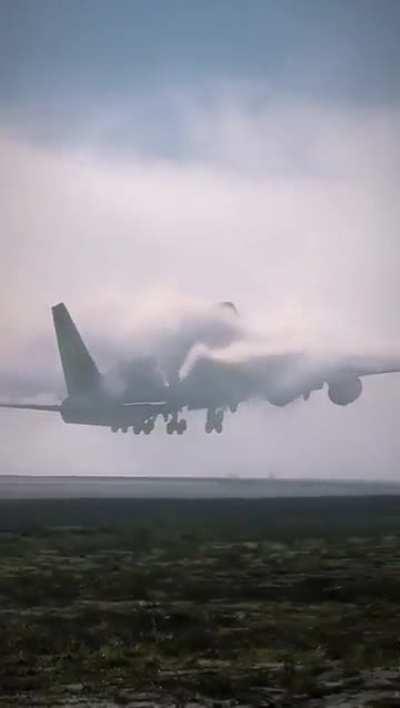 Airplane disappearing in a wall of clouds 