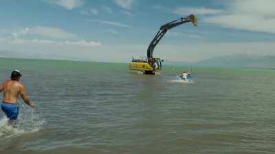 Youtuber increases speed of excavator and suddenly stops with his friend harnessed to it (all for a video)