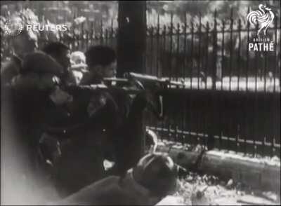 Members of the French Resistance battling German soldiers in Paris (1944, WWII).