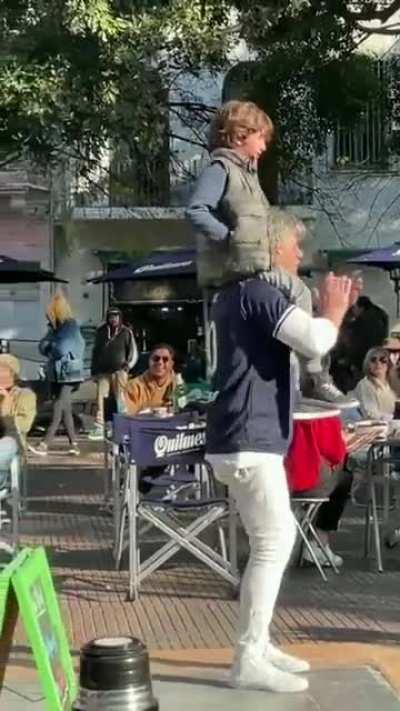 A young boy lost his dad in a crowd in Argentina. Strangers came together to help, chanting the father's name. Then the band joined in with a song, 