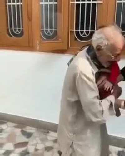 Grandpa seeing his grandson after a long time.