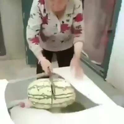 WCGW trying to open watermelon on a glass table