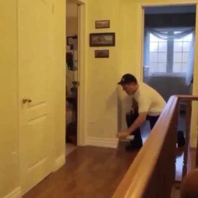 Dad pranks son by faking alarm and making him slip gets instant karma for laughing