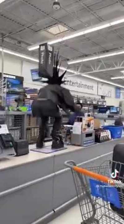 Man climbs onto the counter at Walmart, announces that his hair is the tallest, and then proceeds to blast music at the workers