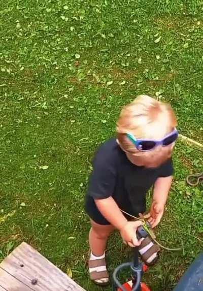 Kid perfectly imitating the sound of a lawn cutter