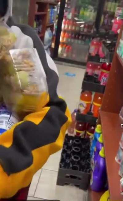 Store clerk lets boy grab whatever he wants and covers it