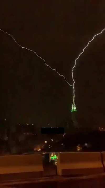 Lightening hits a clock tower