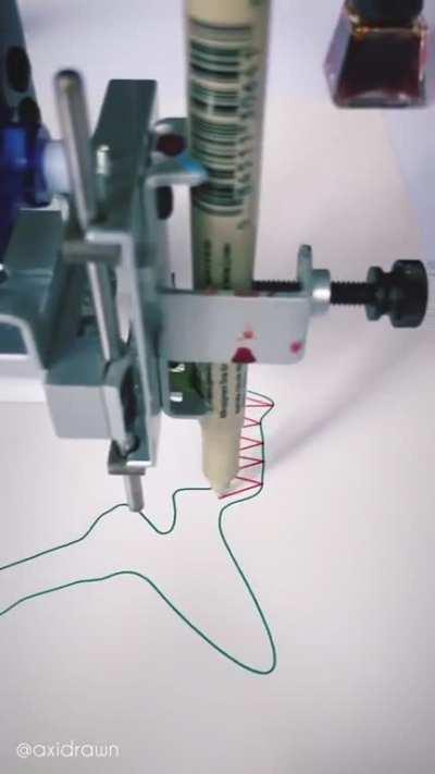 Pen plotter programmed to sync with piano piece 