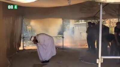 Israeli police breaking up a peaceful muslim prayer with teargas