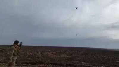 Ukrainian drone filming drone that's recovering fallen drone