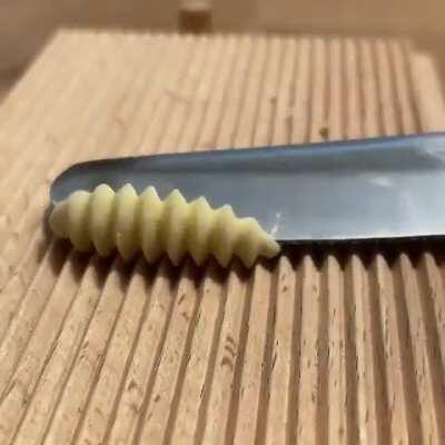 Making Gnocchi Pasta with a grooved board