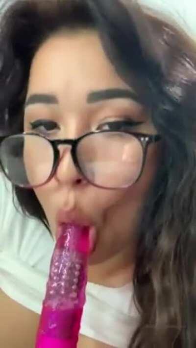 Sucking on a dildo