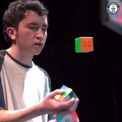 Colombian Angel Alvarado solves three Rubik’s Cubes while juggling them