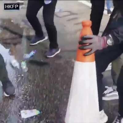 Hong Kong 2019 protest, see how they put out tear bombs dropped on demonstrators.