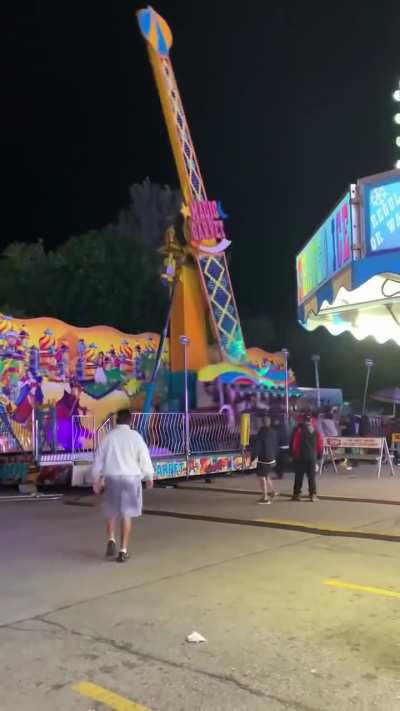 Fair goers use their body weight to stabilize an unstable ride. 