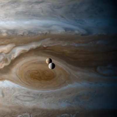 Europa &amp;amp; Io moons orbiting Jupiter, captured by the Cassini space probe