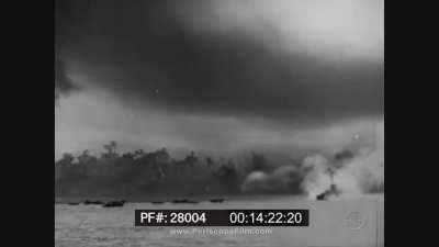 U.S. and Australian warships bombard Borneo's northeast coast (WWII, 1945).