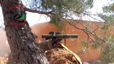 Devastating TOW missile hit on a Syrian army tank by rebels near Mastuma, Idlib province. May 2015. You can briefly see the tank's turret flying through the air.