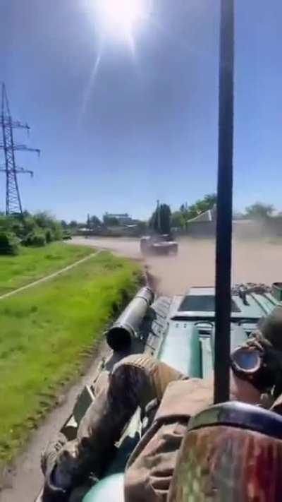 Fighters of the Armed Forces of Ukraine advancing with a trophy BTR-82A as part of the military column, they are also accompanied by American Humvees