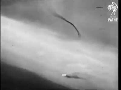 Gunfire from an 8th Air Force fighter detonates the warhead of a V-1 flying bomb