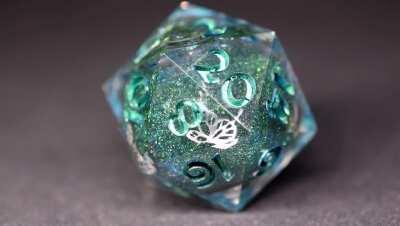 Liquid core d20 I made (And took a macro video!) The glitter calms me.