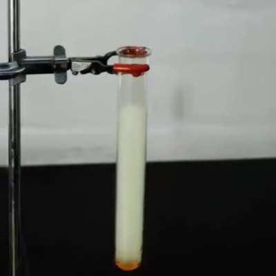 At the bottom of the test tube is liquid phenylacetylene and on top, we have liquified chlorine. When a UV laser is pointed at both, a cool reaction takes place and tetrachloroethylbenzene is formed (black). (Video by ChemicalForce)