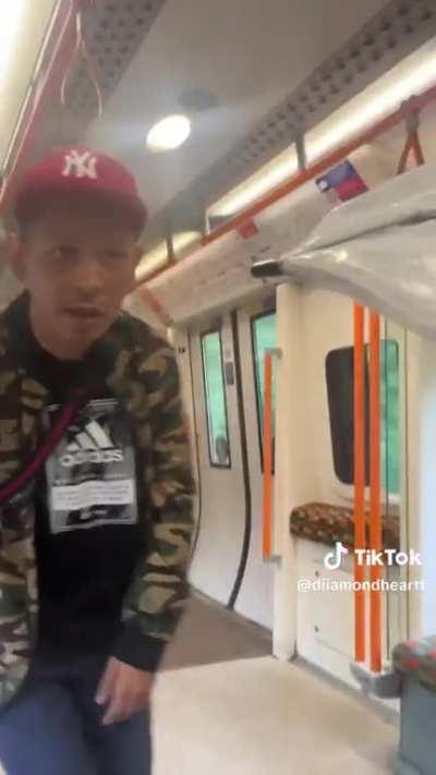 Crazed, racist man verbally and physically assaults women on Tube.