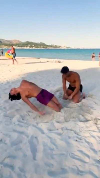 Men blowing other men in beach